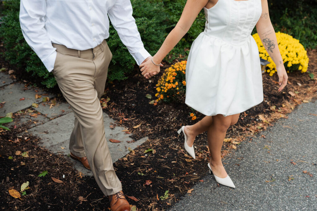 A vintage-inspired late autumn engagement session at Skylands Manor and the New Jersey Botanical Gardens in Ringwood, NJ, featuring fall foliage, classic outfits, and romantic garden portraits.