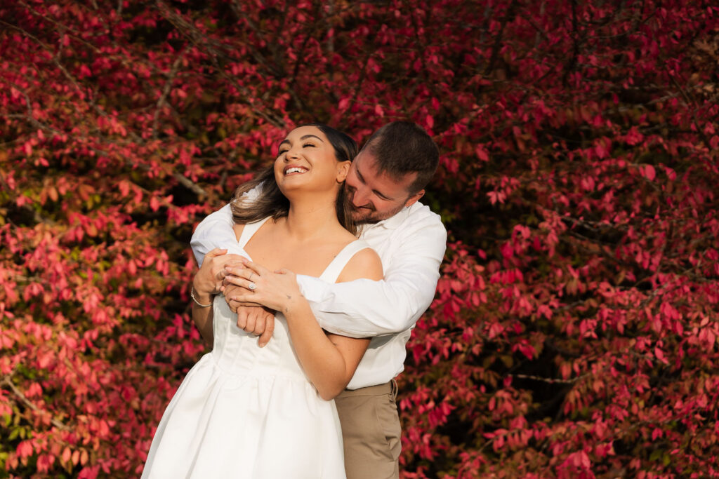 A vintage-inspired late autumn engagement session at Skylands Manor and the New Jersey Botanical Gardens in Ringwood, NJ, featuring fall foliage, classic outfits, and romantic garden portraits.