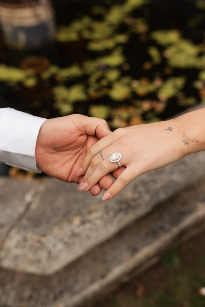 A vintage-inspired late autumn engagement session at Skylands Manor and the New Jersey Botanical Gardens in Ringwood, NJ, featuring fall foliage, classic outfits, and romantic garden portraits.
