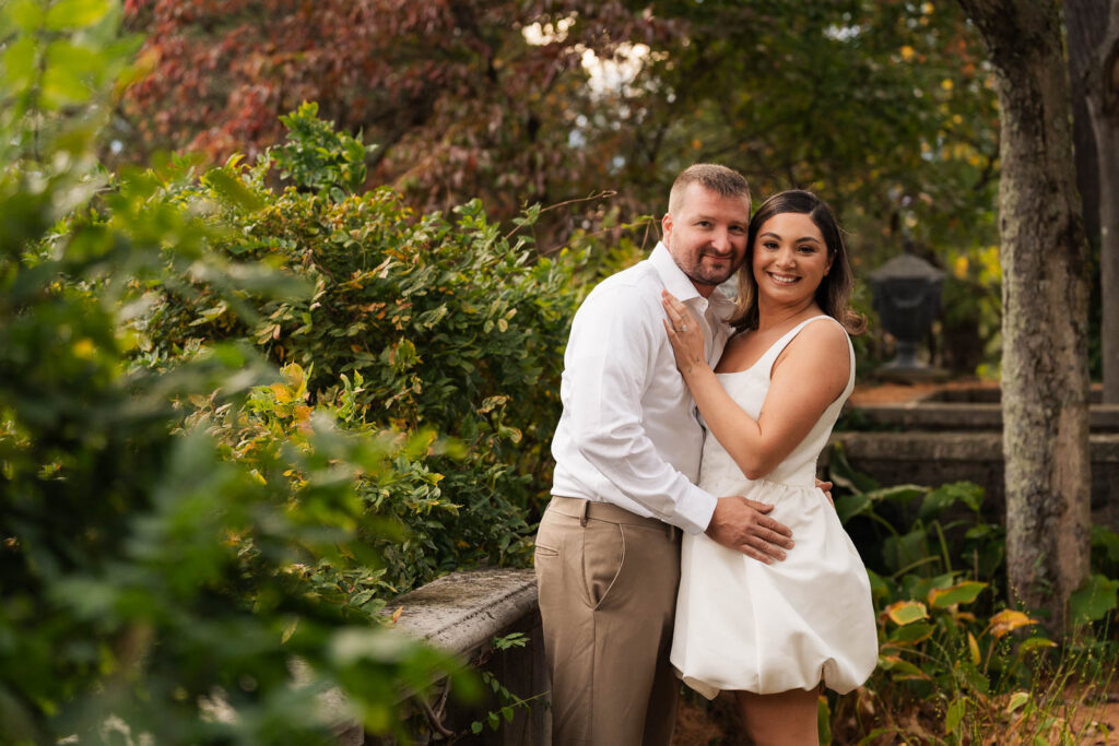 A vintage-inspired late autumn engagement session at Skylands Manor and the New Jersey Botanical Gardens in Ringwood, NJ, featuring fall foliage, classic outfits, and romantic garden portraits.