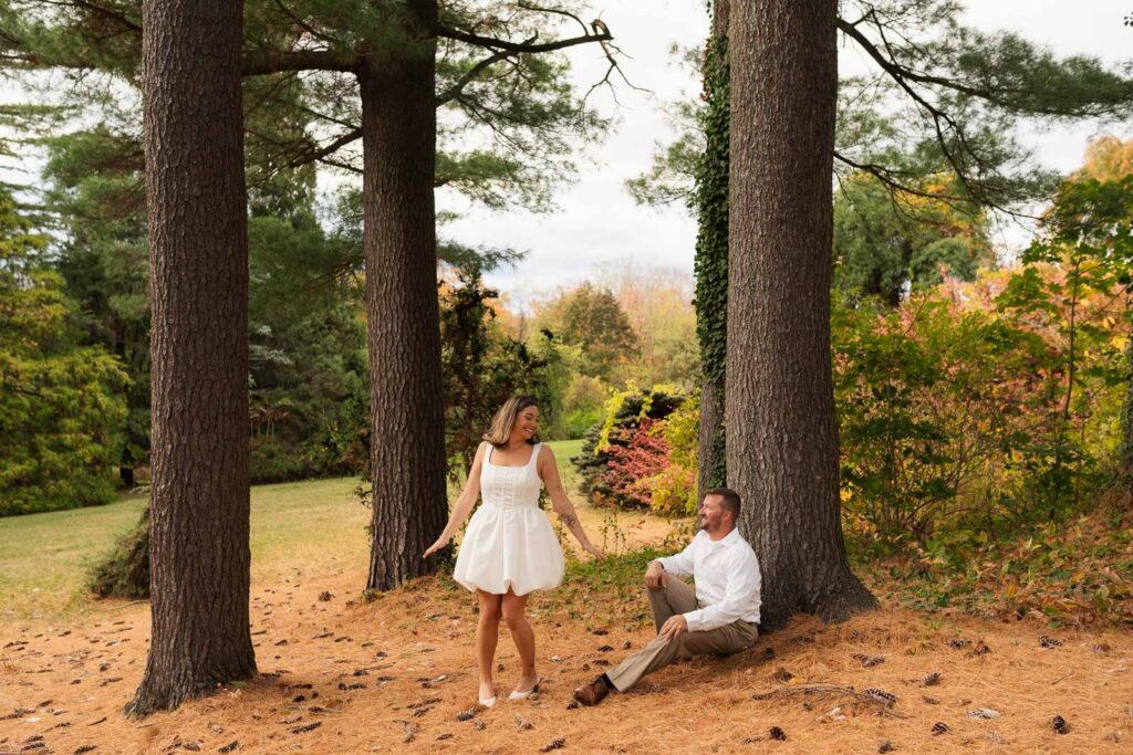 A vintage-inspired late autumn engagement session at Skylands Manor and the New Jersey Botanical Gardens in Ringwood, NJ, featuring fall foliage, classic outfits, and romantic garden portraits.