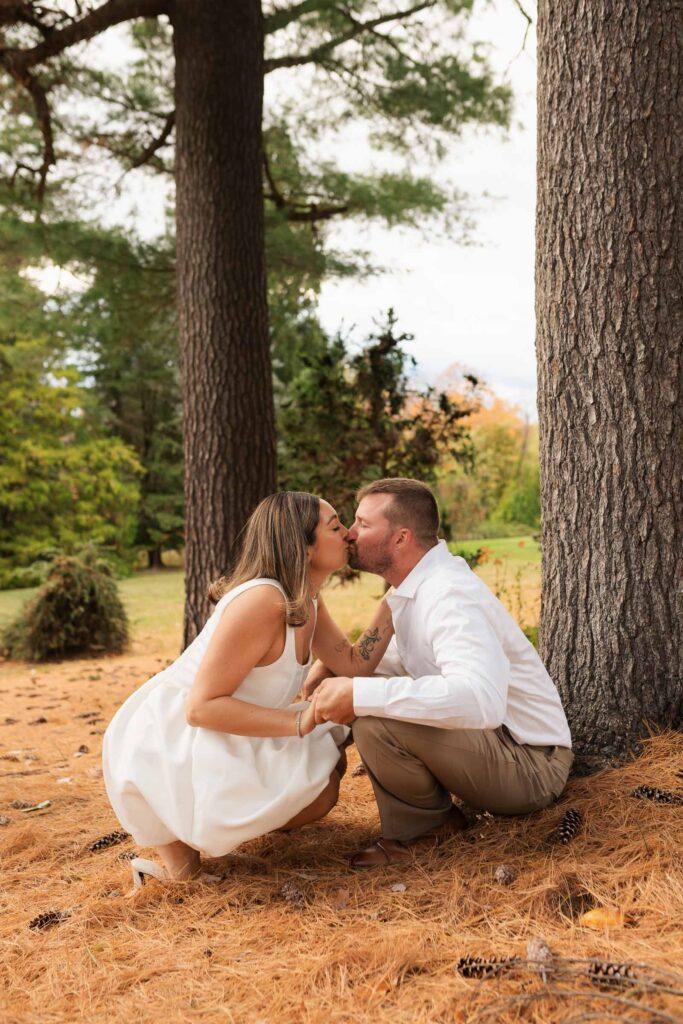 A vintage-inspired late autumn engagement session at Skylands Manor and the New Jersey Botanical Gardens in Ringwood, NJ, featuring fall foliage, classic outfits, and romantic garden portraits.