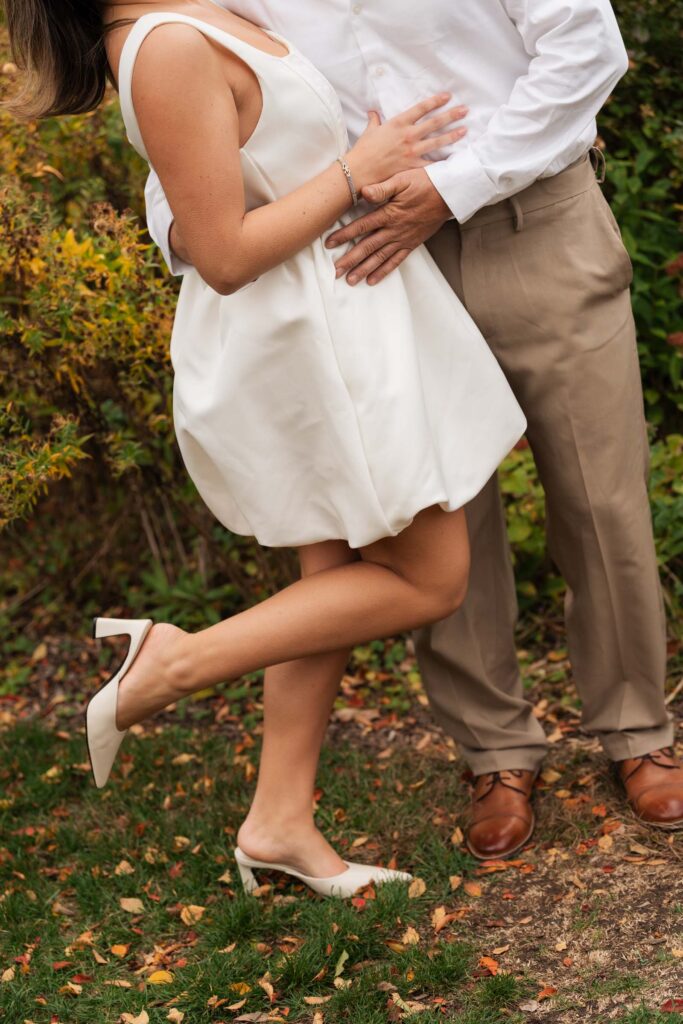 A vintage-inspired late autumn engagement session at Skylands Manor and the New Jersey Botanical Gardens in Ringwood, NJ, featuring fall foliage, classic outfits, and romantic garden portraits.