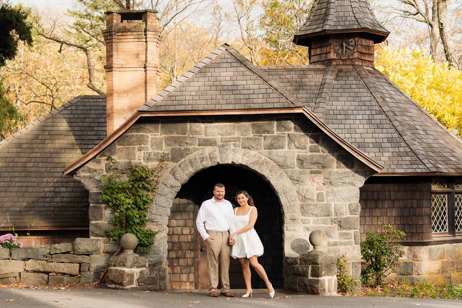 A vintage-inspired late autumn engagement session at Skylands Manor and the New Jersey Botanical Gardens in Ringwood, NJ, featuring fall foliage, classic outfits, and romantic garden portraits.
