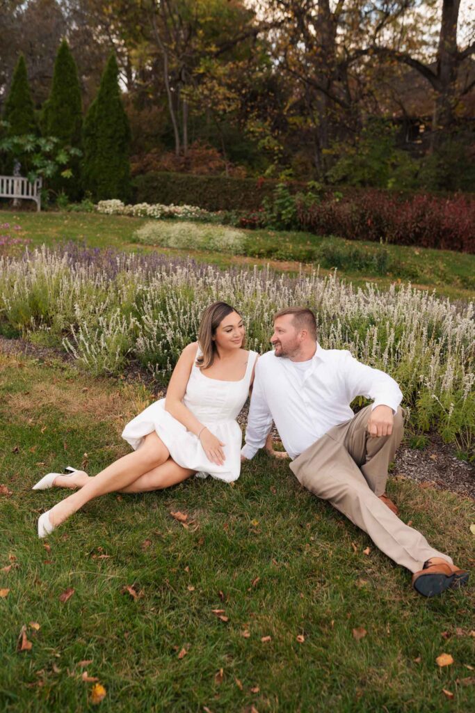 A vintage-inspired late autumn engagement session at Skylands Manor and the New Jersey Botanical Gardens in Ringwood, NJ, featuring fall foliage, classic outfits, and romantic garden portraits.