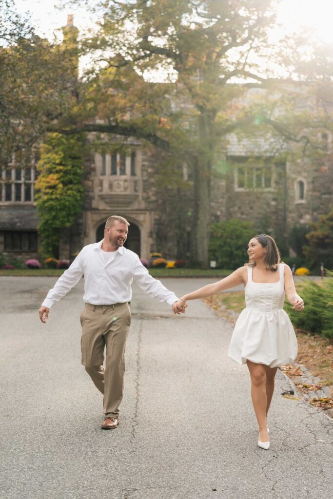 A vintage-inspired late autumn engagement session at Skylands Manor and the New Jersey Botanical Gardens in Ringwood, NJ, featuring fall foliage, classic outfits, and romantic garden portraits.