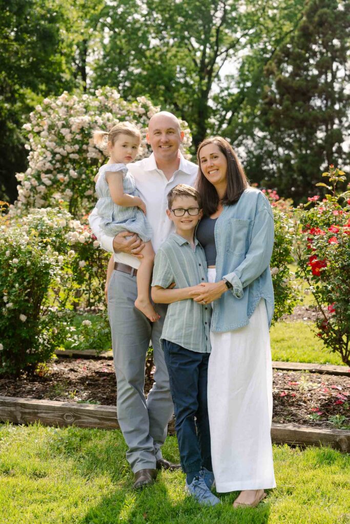 A family photoshoot in Brookdale Park Rose Garden's rose garden on a sunny spring afternoon in Bloomfield New Jersey.