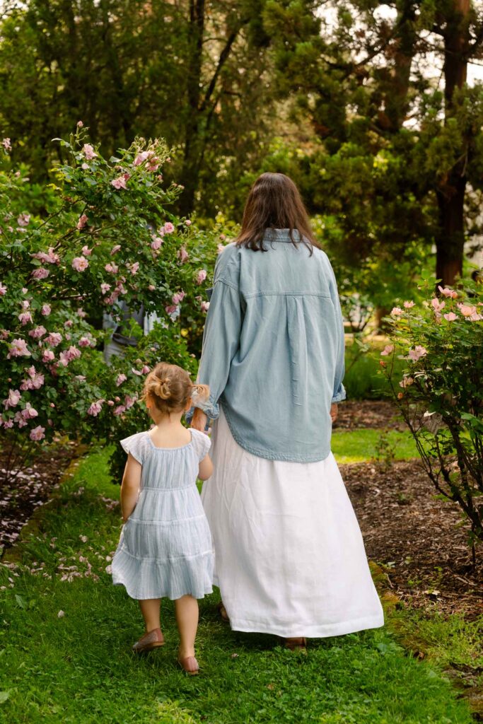 A family photoshoot in a rose garden on a sunny spring afternoon in Bloomfield New Jersey.