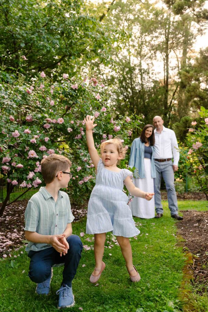A family photoshoot in a rose garden on a sunny spring afternoon in Bloomfield New Jersey.