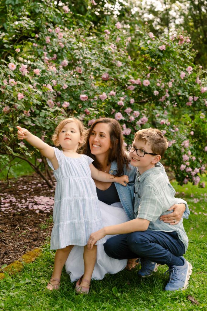 A family photoshoot in Brookdale Park Rose Garden's rose garden on a sunny spring afternoon in Bloomfield New Jersey.