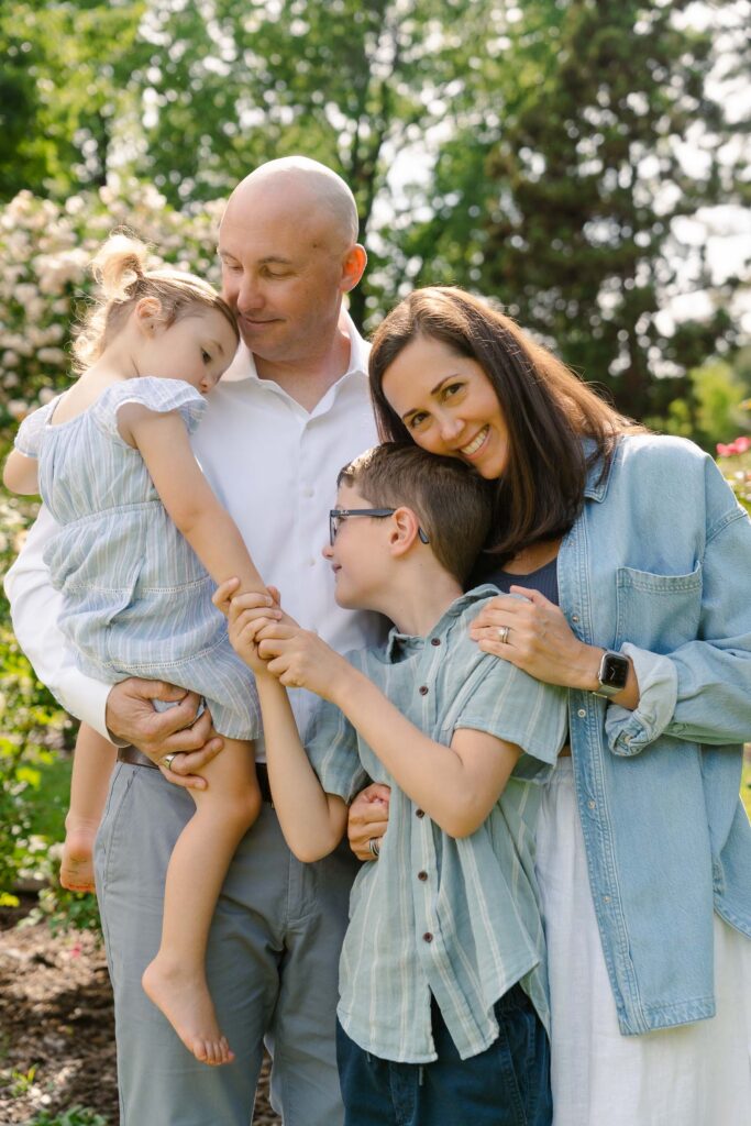 A family photoshoot in Brookdale Park Rose Garden's rose garden on a sunny spring afternoon in Bloomfield New Jersey.