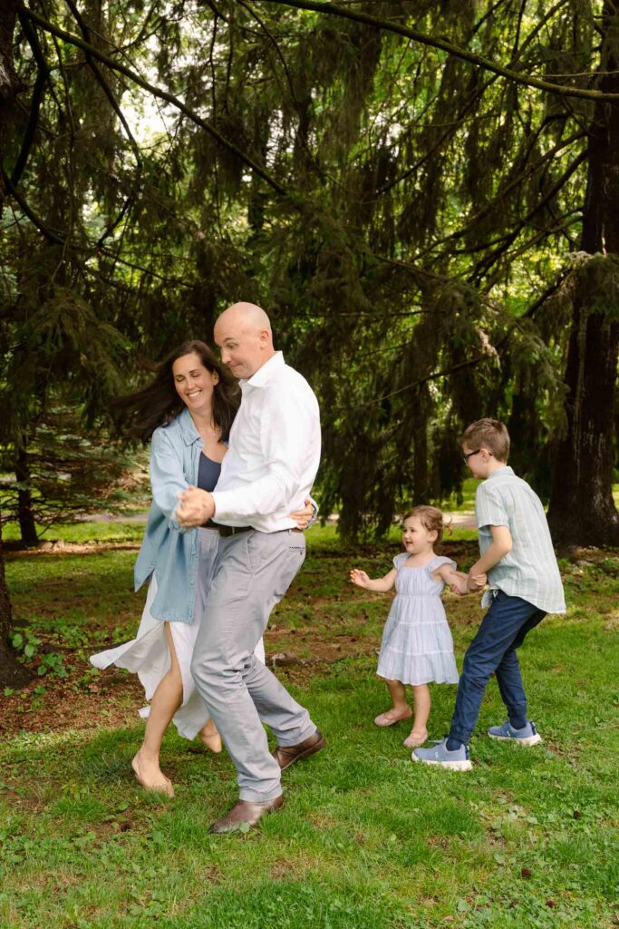 A family photoshoot in Brookdale Park Rose Garden's rose garden on a sunny spring afternoon in Bloomfield New Jersey.