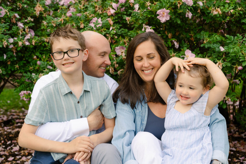 A family photoshoot in Brookdale Park Rose Garden's rose garden on a sunny spring afternoon in Bloomfield New Jersey.