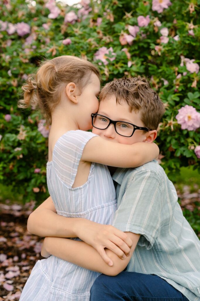 A family photoshoot in a rose garden on a sunny spring afternoon in Bloomfield New Jersey.