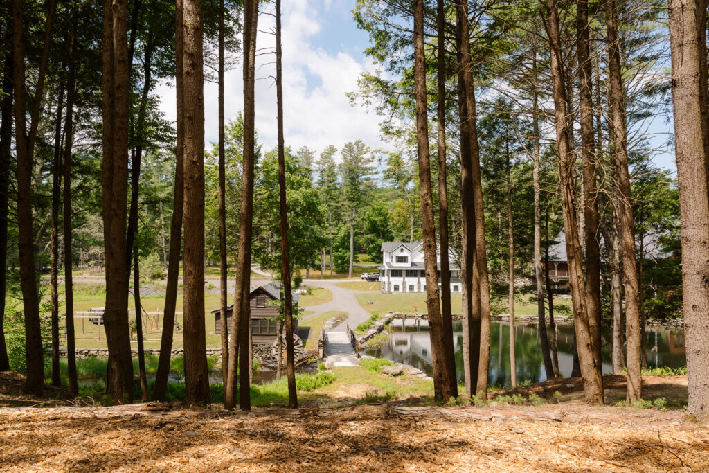 Pine Brook Manor wedding venue in New York surrounded by forests and natural landscapes.