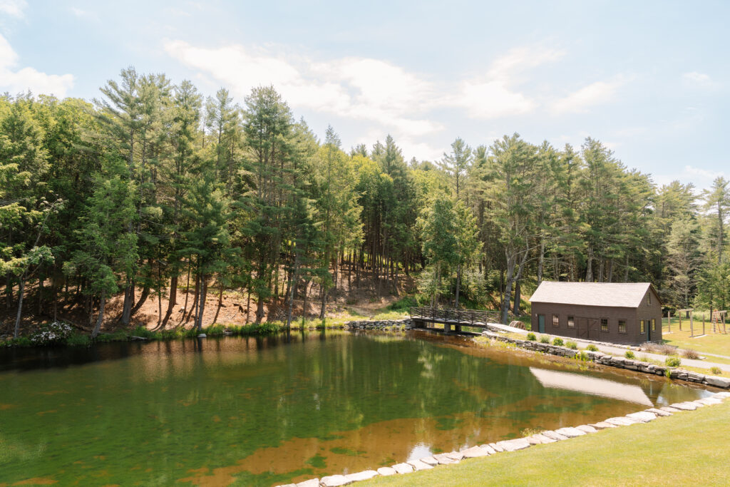 Pine Brook Manor wedding venue in New York surrounded by forests and natural landscapes.